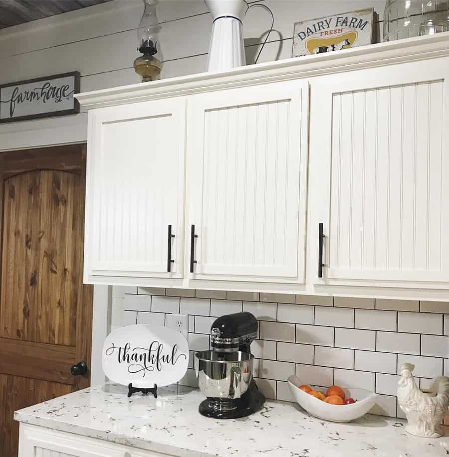 White beadboard kitchen cabinets