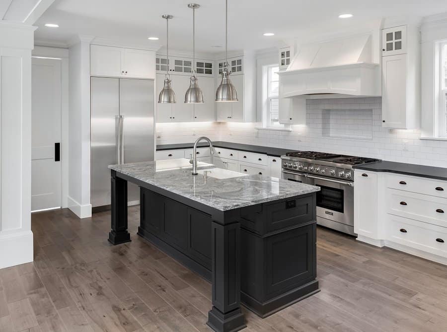 White cabinets with black countertop and black handles