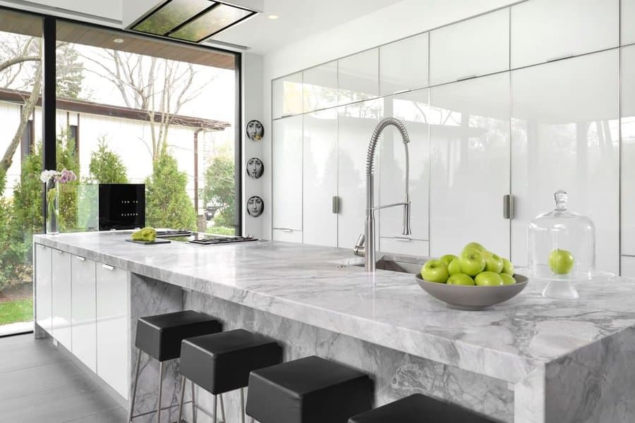 White cabinets with marble countertop