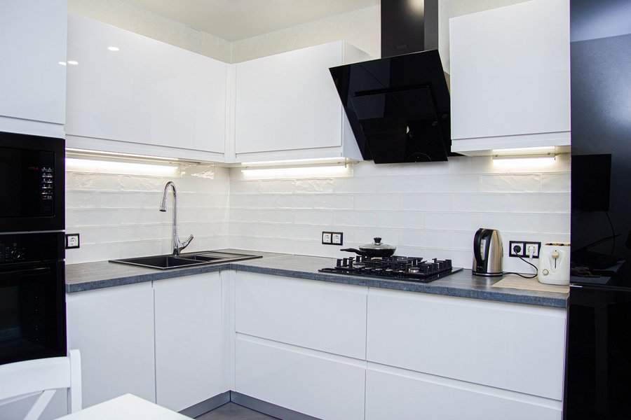 White cabinets with marble countertop