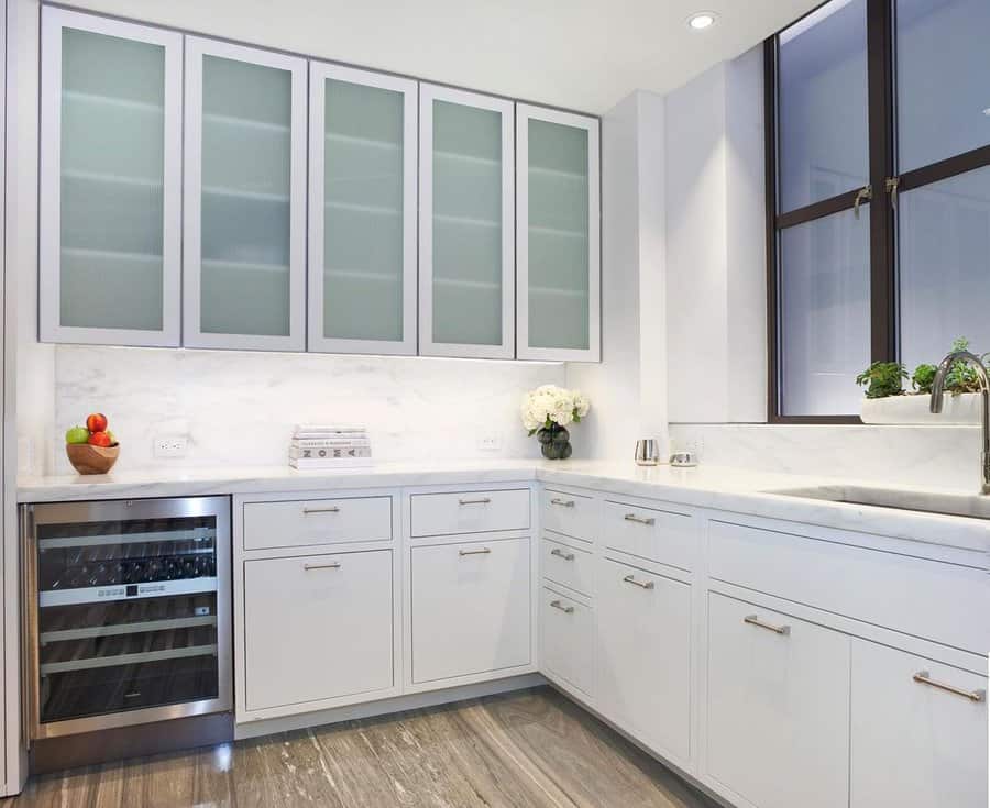 White cabinets with marble countertop