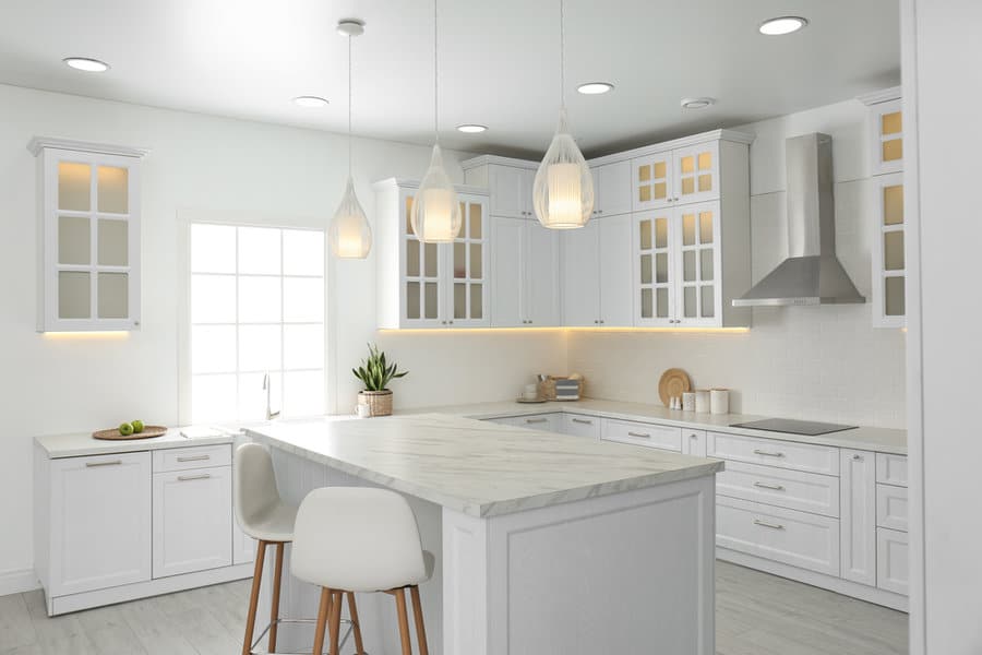 Minimalist Kitchen Island Pendant Lighting Ideas 4 Airy kitchen with teardrop pendants and a bright window