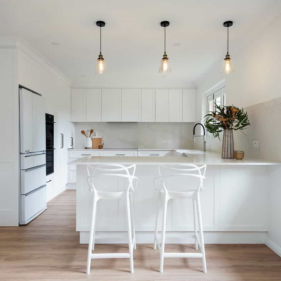 White kitchen cabinets with subway tile backsplash