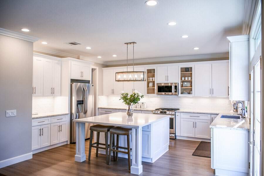 White kitchen cabinets with subway tile backsplash