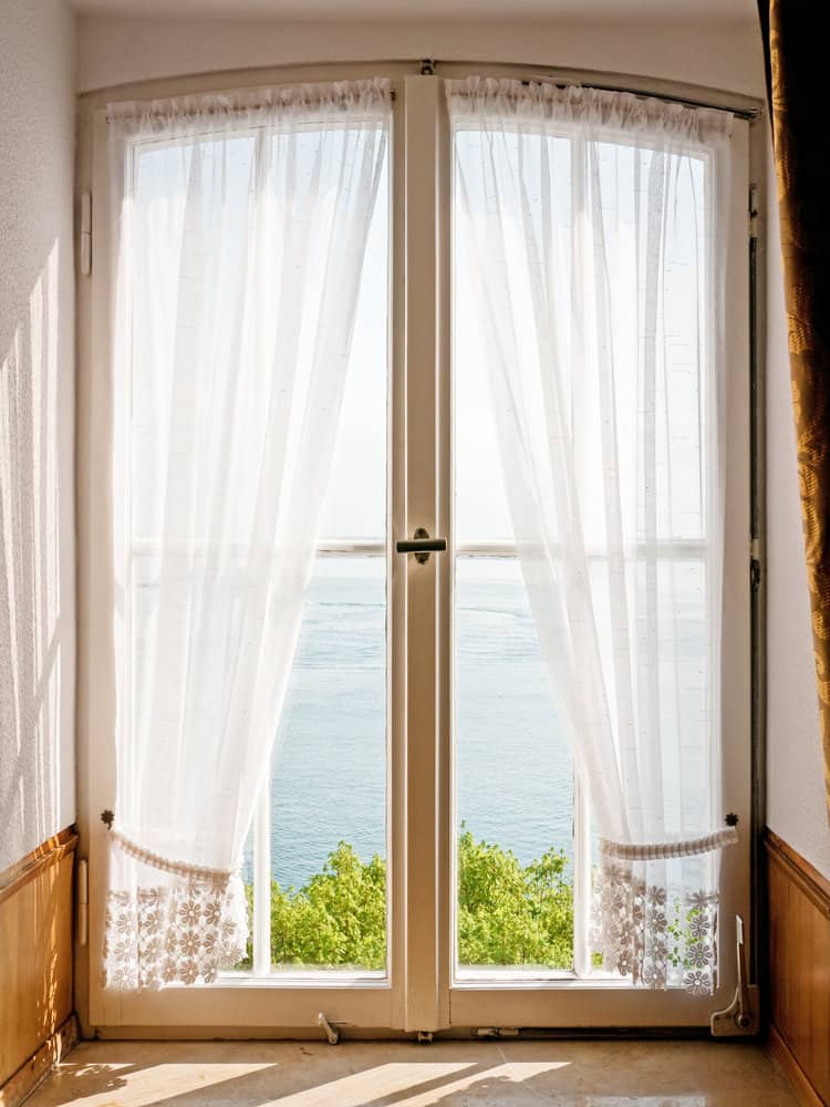 Modern living space with white curtains