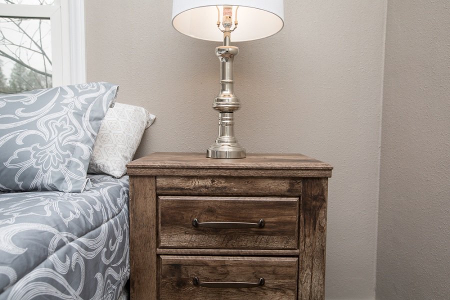 Wooden nightstand in bedroom